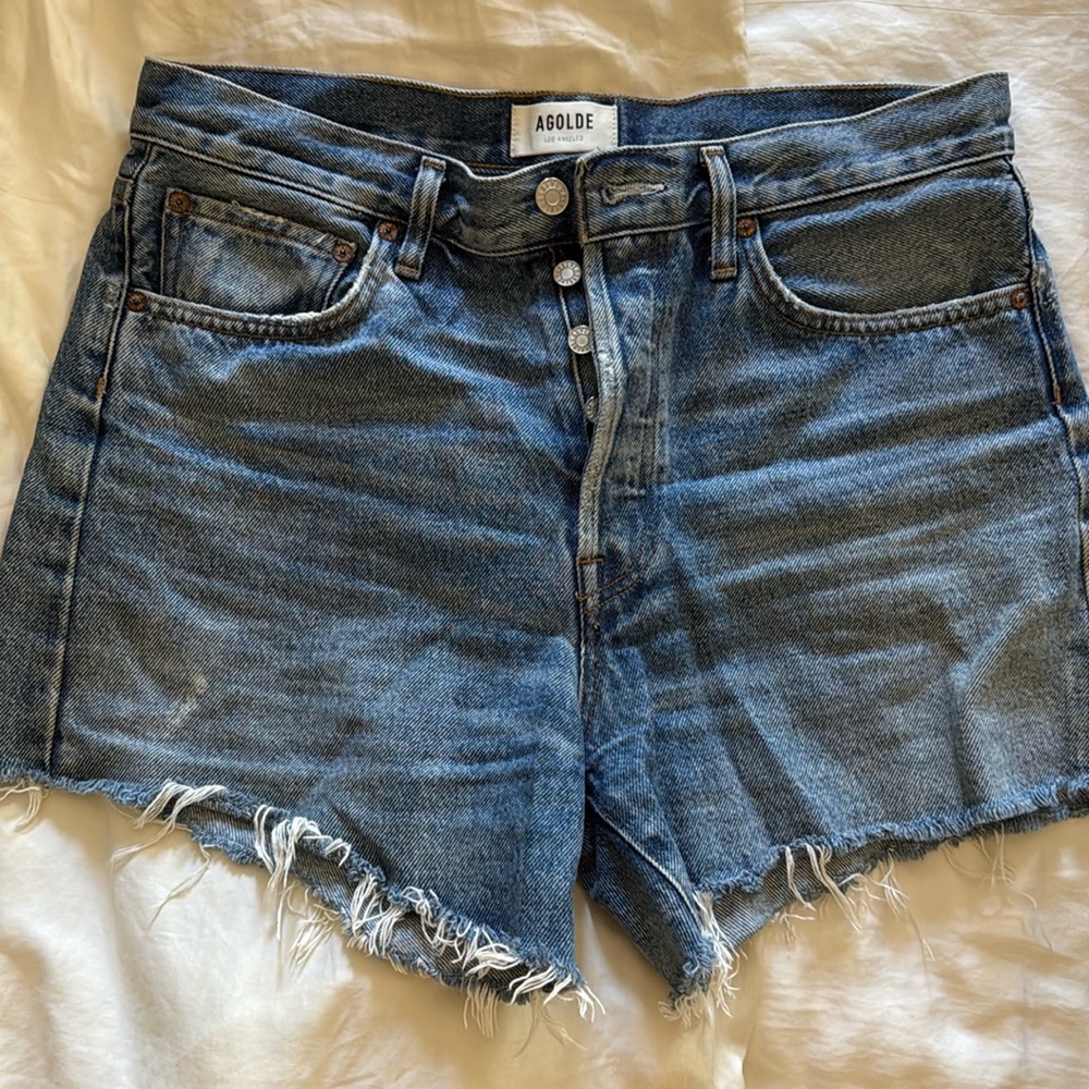 Frayed hem denim shorts with button closure